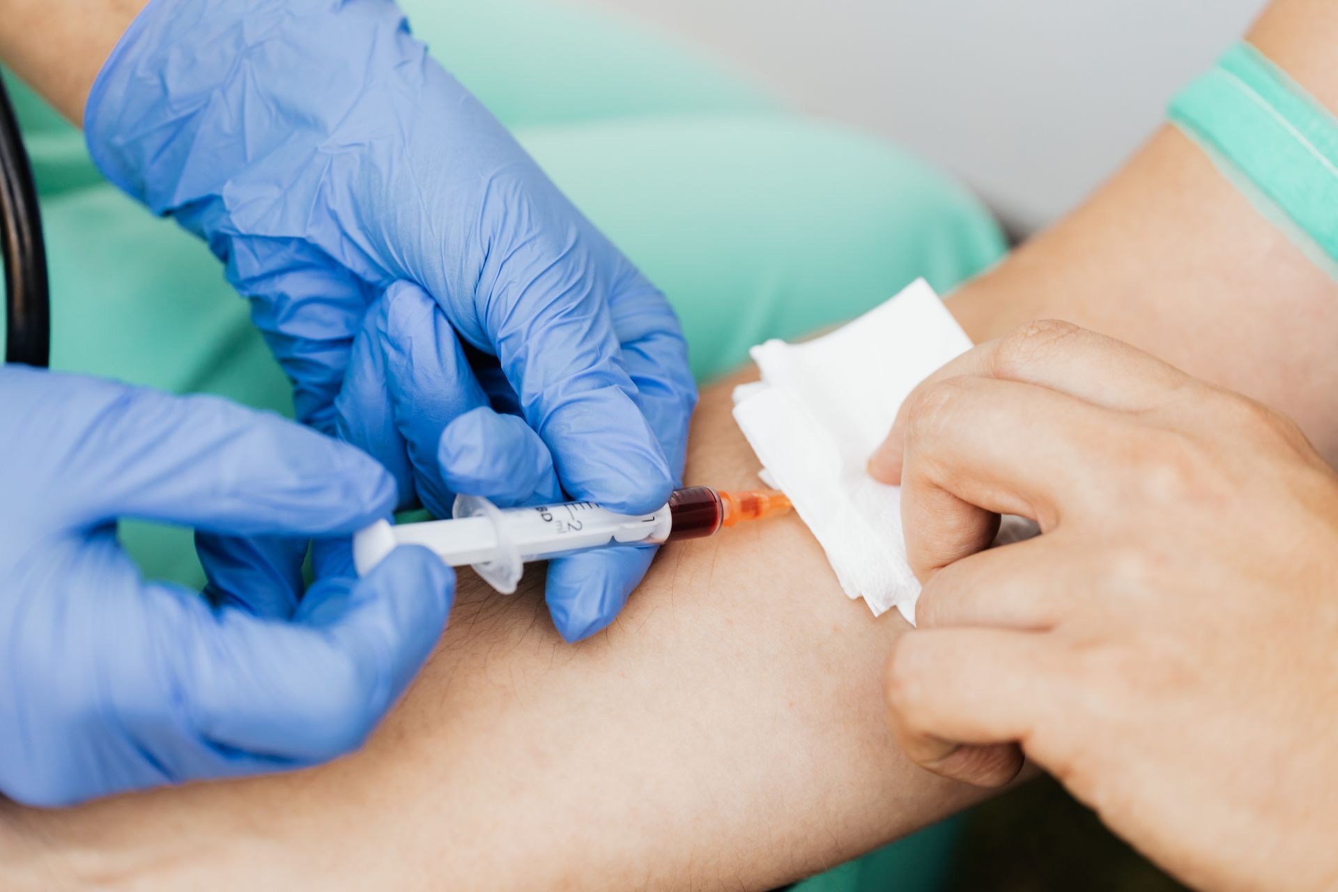 Blood being drawn from a patient's arm